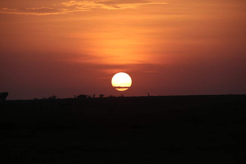 Sunrise over horizon, Maasai Mara Nature Reserve, Kenya